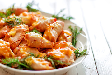 Roast chicken with fennel on a white wooden background