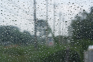 Abstract backgrounds  drops of rain on glass Overlooking the poles blur.