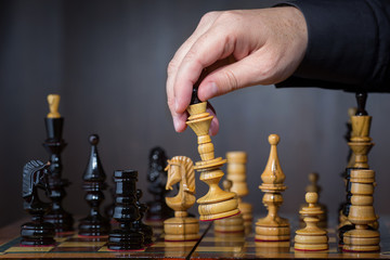 Game in chess. The chess player makes the move