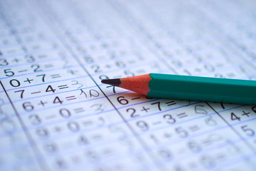 pencil is on notebook with mathematical examples