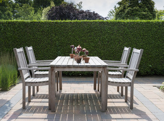 wooden garden furniture in garden
