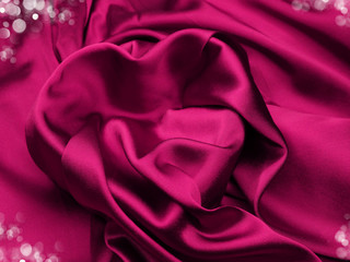 red satin material with heart shape love concept