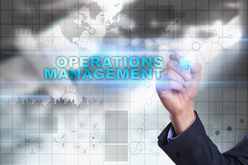 Businessman is drawing on virtual screen. operations management concept.