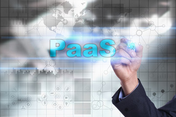 Businessman is drawing on virtual screen. paas concept.