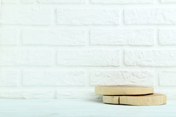 Cross section of tree trunk on the brick wall background