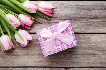 Bouquet of tulips on a grey wooden table