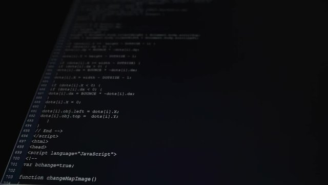 Computer class. On the computer works are carried out. On the monitor there is a process of introduction of a code. The code of the program is the text written in any programming language.