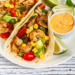 Shrimp Tacos with Corn and Avocado Salsa. Selective focus.
