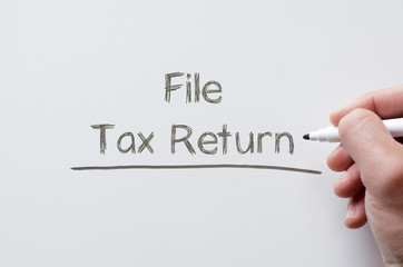 File tax return written on whiteboard