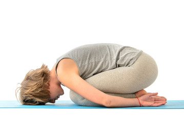 Fototapeta premium Young yoga woman engaged in yoga. Isolated on white background