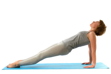 Young yoga woman engaged in yoga. Isolated on white background