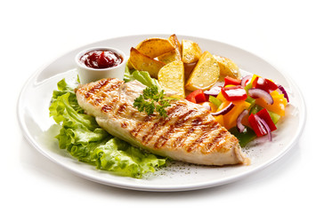 Grilled chicken fillet, chips and vegetable salad 