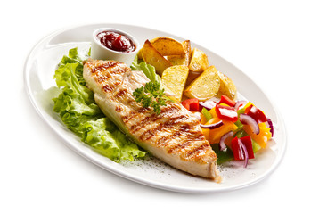 Grilled chicken fillet, chips and vegetable salad 