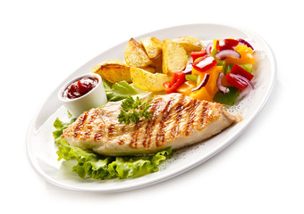 Grilled chicken fillet, chips and vegetable salad 