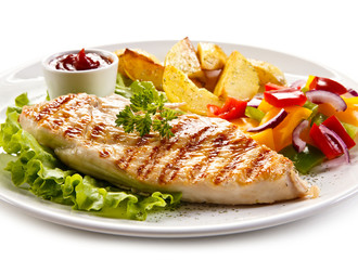 Grilled chicken fillet, chips and vegetable salad 