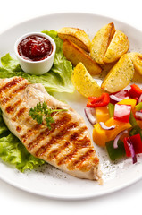 Grilled chicken fillet, chips and vegetable salad 
