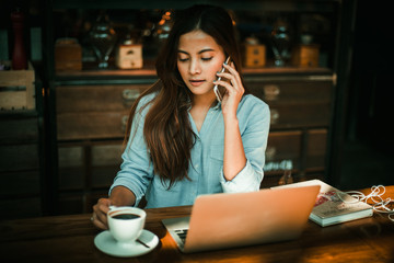 Asian woman working in coffee shop