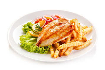 Grilled chicken fillet, chips and vegetable salad 