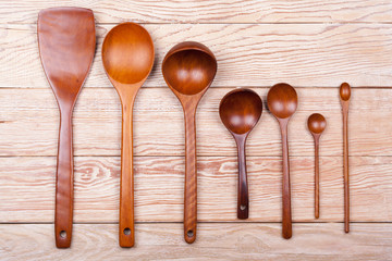 Assorted wooden tableware on wooden table