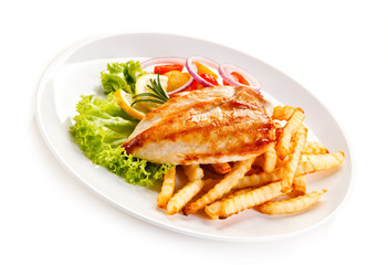 Grilled chicken fillet, chips and vegetable salad 
