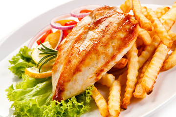 Grilled chicken fillet, chips and vegetable salad 