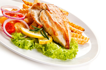 Grilled chicken fillet, chips and vegetable salad 