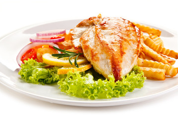 Grilled chicken fillet, chips and vegetable salad 