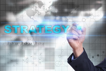 Businessman is drawing on virtual screen. strategy concept.