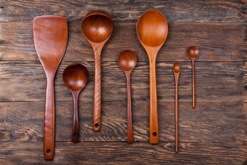 Assorted wooden tableware on wooden table