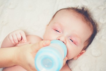 Hungry baby drinking milk