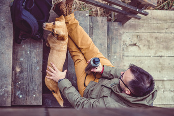 Hiker and dog resting