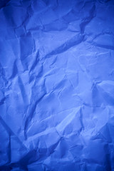 Blue crumpled paper texture background.