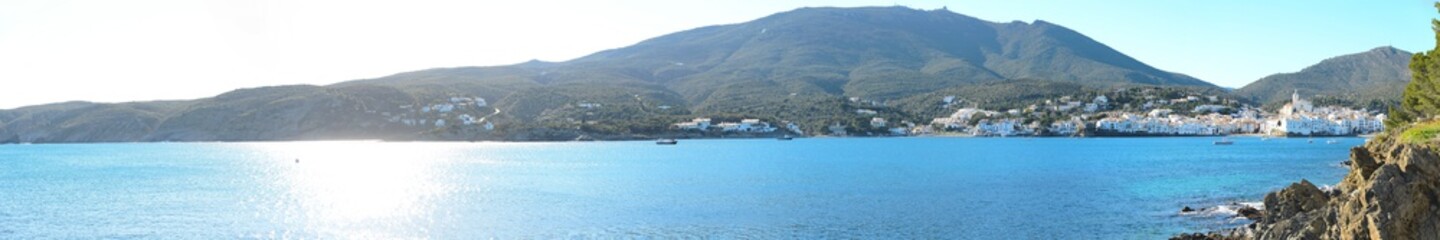 panoramic cityscape of Dali famous landmark spanish village Cadaques port on blue mediterranean sea...