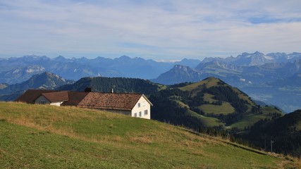 Fototapeta na wymiar Mountain ranges and restaurant. View from mount Rigi, Switzerland.