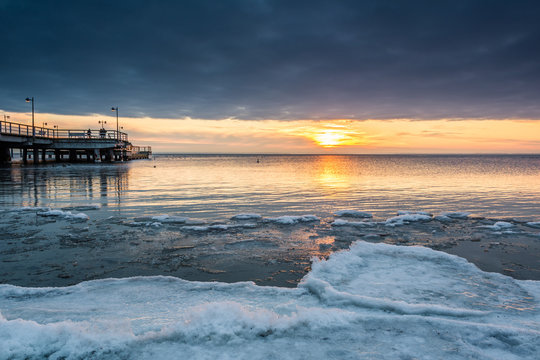Sunset over frozen Baltic Sea in winter. Poland.