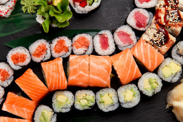 Japanese cuisine. Sushi on a stone plate.