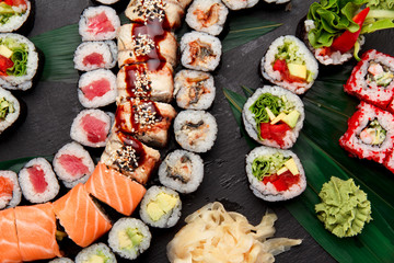Japanese cuisine. Sushi on a stone plate.