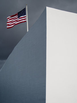 An American flag flys over the Arizona Memorial where the USS Arizona was sunk during the attack on Pearl Harbor on Oahu Hawaii.
