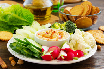 homemade hummus with raw vegetables.