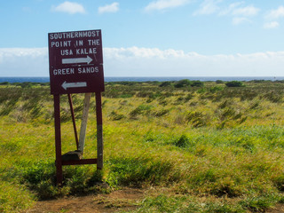 A signpost directing visitors to the southernmost point of the United States in Hawaii.