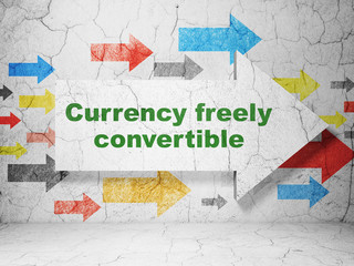 Currency concept: arrow with Currency freely Convertible on grunge wall background