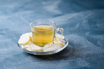 Candied ginger with green tea. Selective focus.