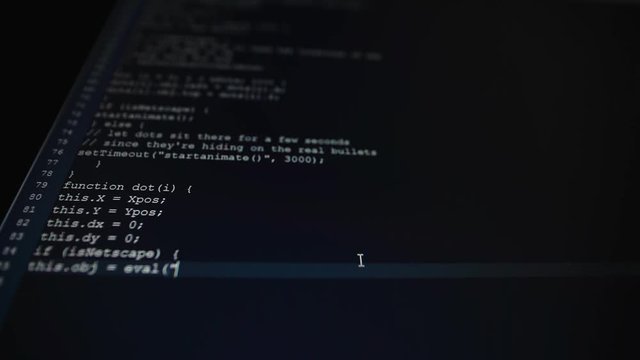 On a dark computer screen typing, probably some programmer type on the keyboard the new program. The program weighs a lot, because it already takes 100 lines of text
