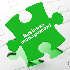 Business concept: Business Management on puzzle background