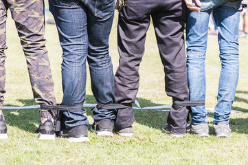 Five legged race outdoor party game, harmonious unity concept