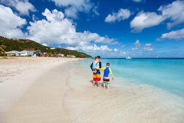 Father with kids at beach