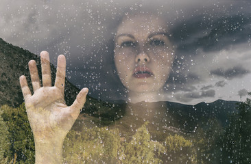 double exposure a woman behind the window