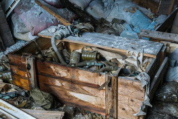 abandoned school room with masks in box on the floor in Pripyat, Chernobyl, Ukraine