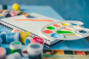 Paper, watercolors, paint brush and some art stuff