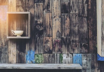 Old wooden wall background with shelves and old coffee cup